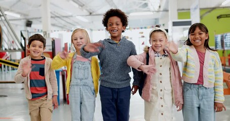Education, diversity and children wave with friends in a classroom together for learning, growth or development. Portrait, smile and happy student kids saying hello in back to school class together