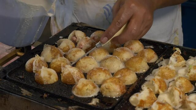 thailand night market street food booth cooking squid octopus cuttlefish ball