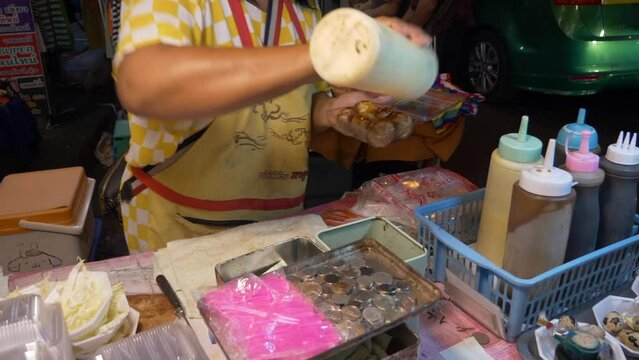 thailand night market street food booth squid octopus cuttlefish