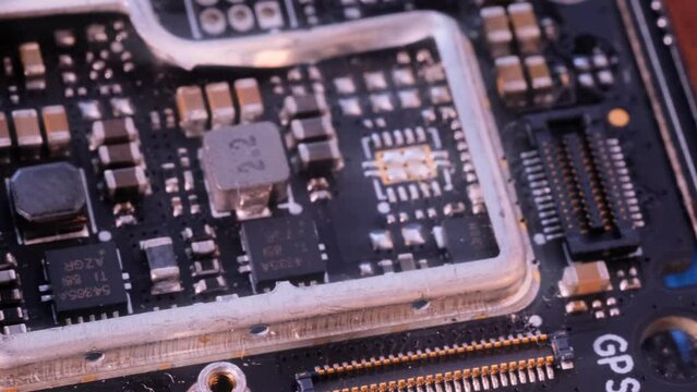 Microprocessors, tracking shot. Computer PC chip microchip blue light close up. Global semiconductor chip shortage. Computer motherboard components. 