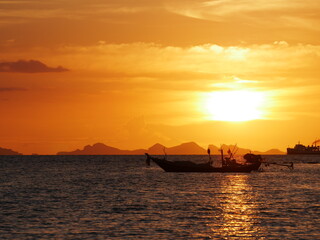sunset over the sea, view of the sea and mountains, Tropical sandy beach in sea lagoon at sunrise, Beach Paradise, clouds in the sky over the ocean and the beach area