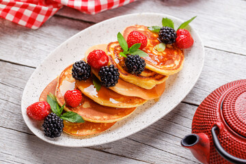 Tasty homemade pancakes with berries