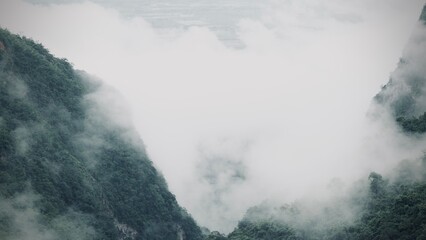 Scenic view of  misty mountain in winter season at  Doi Pha Hee, Chiang Rai, Thailand.