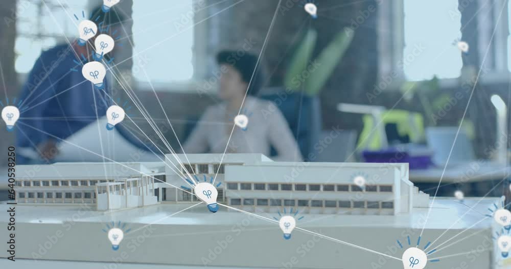 Poster animation of lightbulb icons over diverse colleagues discussing with model in office