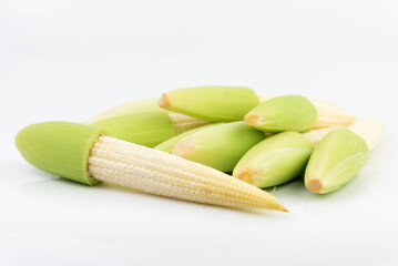 Raw young corn on white background