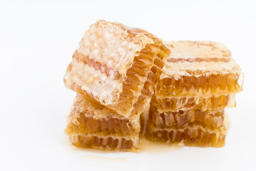 Honeycomb piece. Honey slice isolated on white background