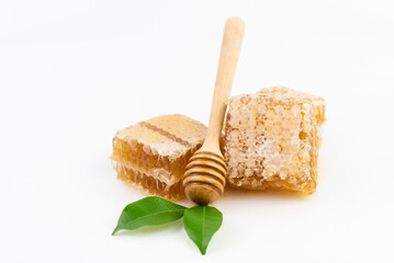 Fototapeta na wymiar honeycomb piece with honey close-up on white background