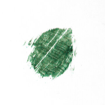 Top view of green scrub smear with microcapsules on white isolated , cosmetic swatch