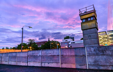 Remains of Berlin Wall at Bernauer Strasse in Berlin, Germany at sunset