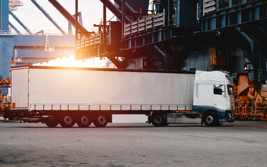 Truck isolated. Vehicle isolated. Commercial transport. Semitrailer during loading the cargo....