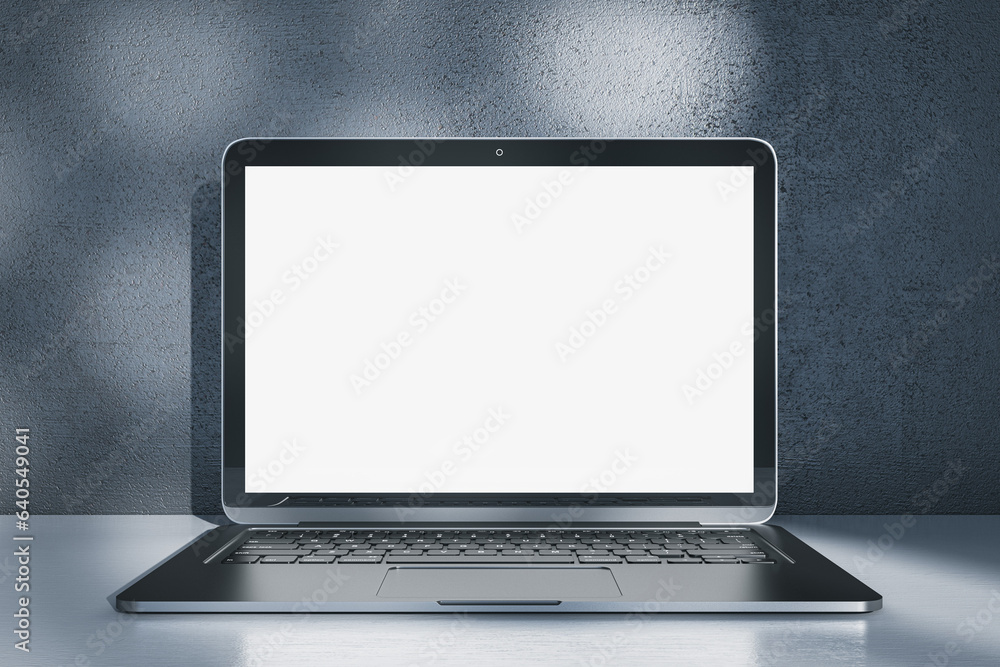 Poster Close up of laptop computer with empty white mock up screen placed on desk. Concrete wall with shadows in the background. 3D Rendering.