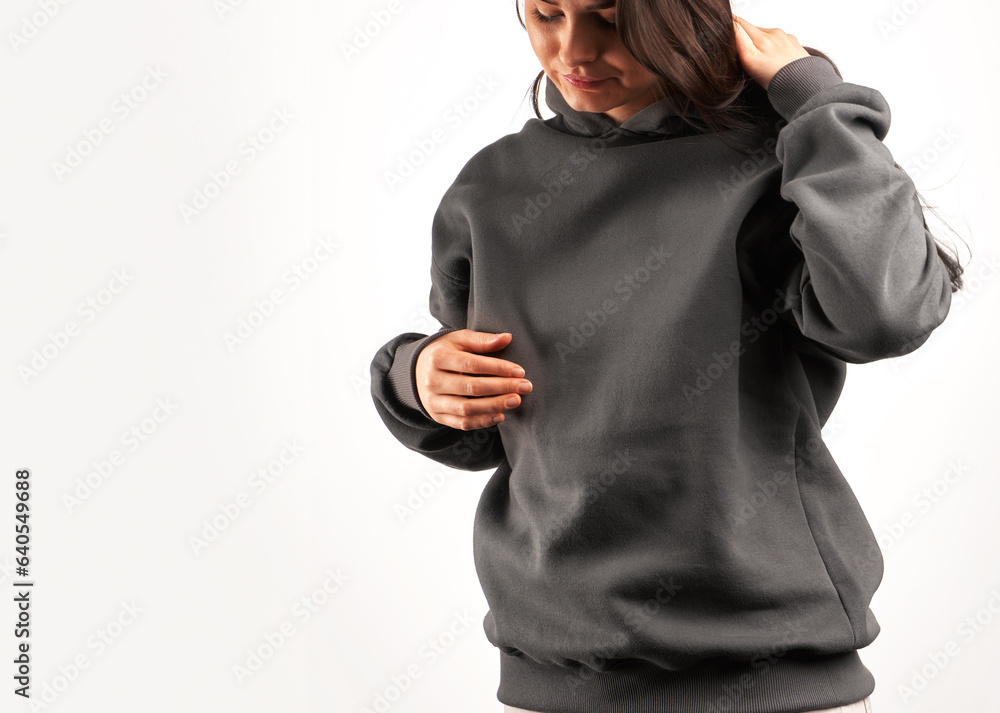 Poster woman wears a plain hoodie. Clothes mockup for logo and branding