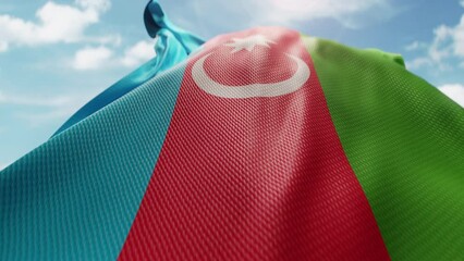 Wavy flag of Azerbaijan blowing in the wind in slow motion. Waving colorful Azerbaijani flag symbol abstract vertical background. Sun and blue sky with clouds on a background