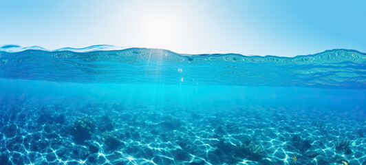 Tranquil sea water surface on coral, and sea fish tropical blue ocean underwater background