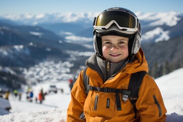 Fototapeta na wymiar happy Boy on the slope of the ski slope