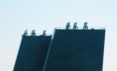 Close-up picture of the exhaust pipes on board the cargo vessel. Air pollution by sulphur emission....