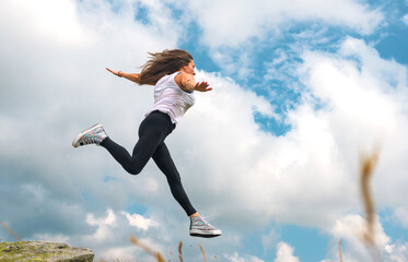 Aspirations, challenges, dreams - concept. The young woman was enjoying the beautiful scenery. The...