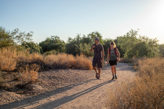 Couple hiking desert nature trail