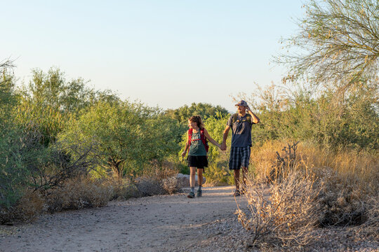 Couple hiking desert nature trail