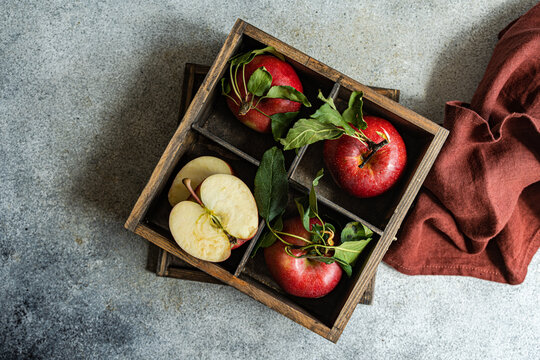 Wooden box full of ripe apples