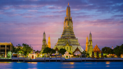 Wat Arun Temple Bangkok during sunset in Thailand. Chao Praya River at sunset at the riverfront
