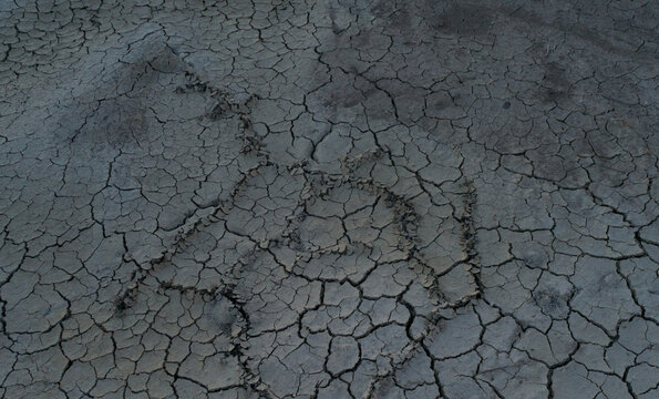 Dry cracked lifeless earth without sun