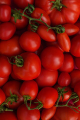 Tomatoes as healthy organic food background. Fresh vegetable at farmers market, diet and agriculture concept. Top view.
