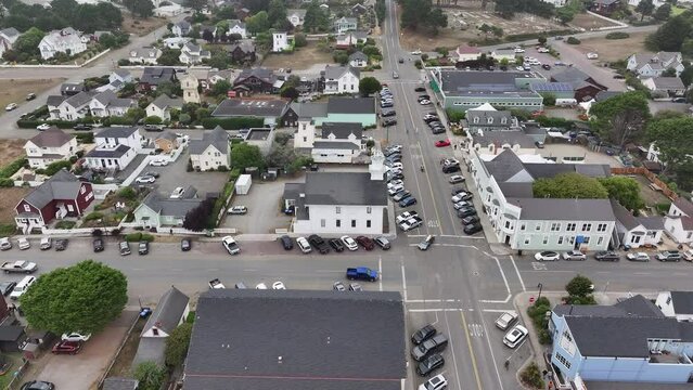 Aerial California Mendocino city Masonic Lodge. Scenic city by Pacific Ocean an artist colony and vacation destination. California State Route 1, Shoreline Highway. Coast often in fog and clouds.