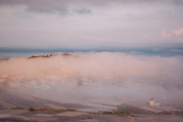 The houses in the suburbs of Da Lat are engulfed in the morning mist