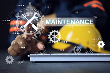 Maintenance engineer working on desktop with laptop computer and wrench symbol in gear, a industrial machine, shows how well taken care of industrial machinery preventive and corrective action. - obrazy, fototapety, plakaty