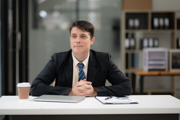 Businessman talking to customers online together at the office.