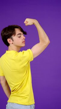 Skinny teenager boy showing biceps muscle. Superficiality concept