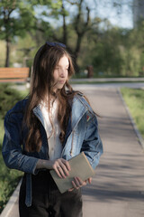 Portrait of a beautiful girl with a book.