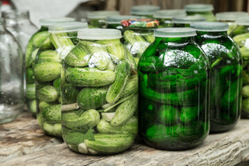Large pickles in glass jar.