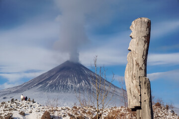 Wooden totem next to the volcano