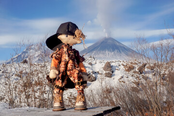 Plush toy on the background of Klyuchevskaya Sopka volcano