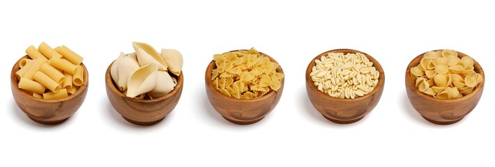 Collection of assorted dry uncooked Italian pasta in wooden bowl on isolated white background. Rigatoni, conchiglioni, farfalle, cavatelli, orecchiette