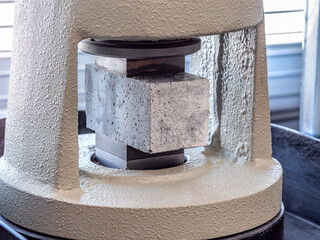 Test of cement compressive strength according to standards, properties of engineered composite materials and cement strength are tested in the physics laboratory. - obrazy, fototapety, plakaty