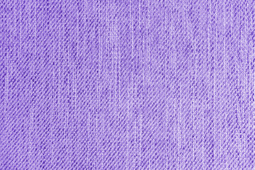 Jacquard woven upholstery, purple coarse fabric texture. Textile background, furniture textile material, wallpaper, backdrop. Cloth structure close up.
