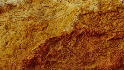 golden yellow rough textured striped quarry stone background is very beautiful for your design, banner, template