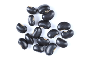 close-up top view raw black beans dried vegetable seeds healthy vegetarian food isolated on white background