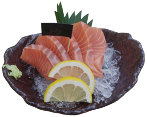 Sliced Salmon sashimi on black plate divided.  Fatty raw fish slices Isolated, Good Japanese Menu.  Healthy Asian Food concept.