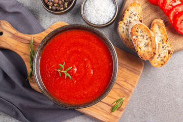Tomato soup with rosemary.  Healthy, vegan and dieting lunch and dinner concept. Gazpacho. 