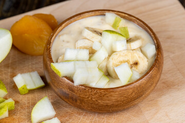 Fototapeta na wymiar fresh yogurt made from milk with pieces of fresh pears