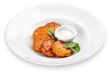 Pumpkin cutlets with white sauce. Vegetarian dish. Isolated image on a white background.