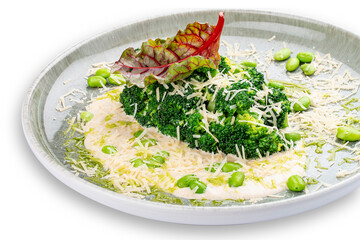 Steamed broccolli with white sauce and beans. Isolated image on a white background.