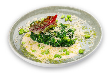 Steamed broccolli with white sauce and beans. Isolated image on a white background.