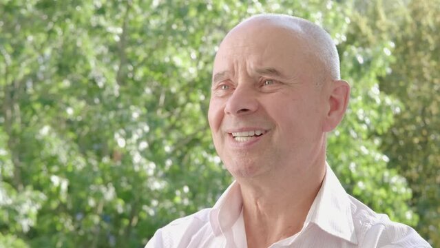funny mature caucasian man 65 years old, senior smiling, Health Care Affects Happiness Levels, recalling happy moments from past, achieved goal or significant accomplishment, positive emotions