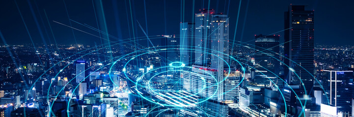 Modern city night view and wireless communication network concept. Wide angle visual for banners or advertisements.