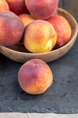 Fototapeta na wymiar ripe delicious and fresh peaches of a red hue